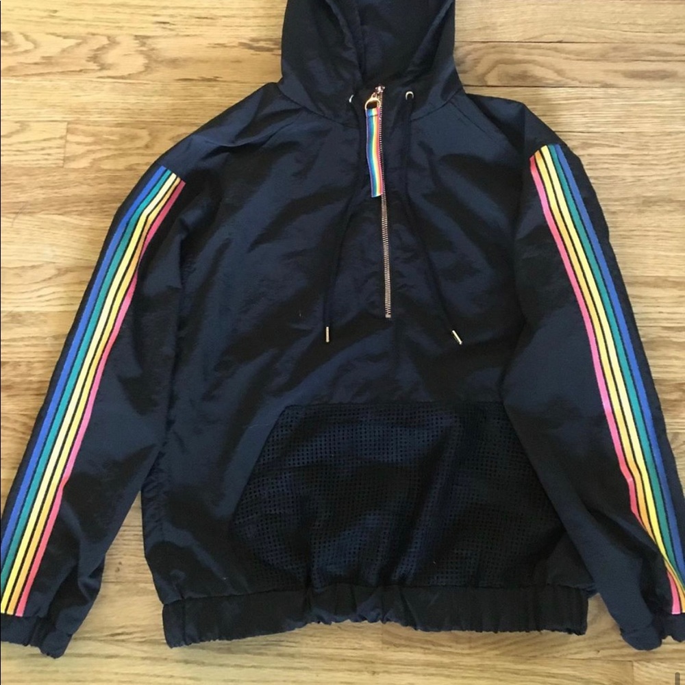 Black windbreaker with rainbow accents.